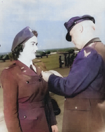 WASP pilot Barbara Erickson being awarded the Air Medal from the Army Air Forces Commanding General, Henry “Hap” Arnold, during the graduation ceremony for WASP cadet class 44-W-2, Avenger Field, Texas, 11 Mar 1944