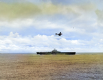 SBD Dauntless scout bomber in the landing pattern preparing to come aboard USS Essex following the raid on Marcus Island, Pacific Ocean, 31 Aug 1943.