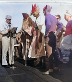 Captain Carlos Wieber bids welcome to the Ruler of the Raging Main, Neptunus Rex, and his Court aboard USS Essex for the Line Crossing ceremony, 1 Sep 1944