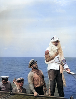 The Ruler of the Raging Main, Neptunus Rex, and his escort arriving on the flight deck of the USS Intrepid for the Line Crossing ceremonies, 22 Jan 1944.