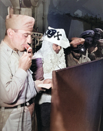 Captain Thomas L Sprague of the USS Intrepid offering remarks of welcome to he Ruler of the Raging Main, Neptunus Rex, and his escort just before for the Line Crossing ceremonies, 22 Jan 1944.