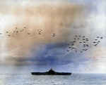 The US Third Fleet steaming in tight formation for a photo opportunity as close to 200 airplanes fly overhead, 22 Aug 1945. Photo taken from USS Wasp (Essex-class). Carrier seen is almost certainly the USS Randolph.