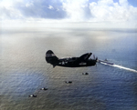 SB2C Helldiver of Bombing Squadron VB-86 approaching the carrier Wasp (Essex-class) near Japan, 1945. Note the white radar pod under the wing.