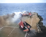 Following an attack from Japanese special attack aircraft, fires grew in the forward hangar deck of USS Saratoga off Iwo Jima, 21 Feb 1945. The fires increased greatly before they could be controlled. Photo 1 of 3