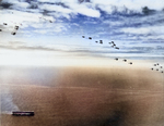 The US Navy’s first aircraft carrier, USS Langley, underway with nearly 60 aircraft flying overhead, 1935.