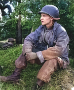 War Correspondent Ernie Pyle speaking to Lieutenant John Mason Brown, northern France, 15 Jun 1944