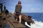 US Sailor removing the securing lines before launching a Mark XIII aerial torpedo from PT Boat operating from the Subchaser Training Center, Miami, Florida, United States, 1944.