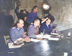 German Colonel General Alfred Jodl (center) signing the surrender document at Dwight Eisenhower