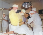 Lieutenant General Joseph Stilwell observing a surgery in progress at a base hospital in Assam, India, 15 Jul 1944