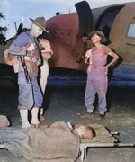 Lieutenant General Joseph Stilwell speaking to a wounded Japanese prisoner of war, northern Burma, 13 Jul 1944