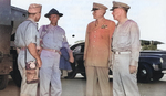 Lieutenant Colonel Paul Jones, General Joseph Stilwell, Major General Patrick Hurley, and Major General Daniel Sultan awaiting for a flight to Chongqing, China at an airfield in New Delhi, India, Sep 1944