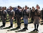 Japanese officers and men saluting the US flag, Maloelap, Marshall Islands, Sep 1945