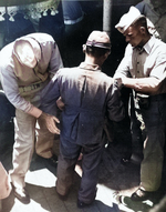 US Marines frisking a Japanese officer upon boarding USS Missouri, 27 Aug 1945