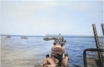 PT-114 and other PT Boats of Motor Torpedo Boat Squadron 6 (MTBRon 6) on patrol in the Solomon Islands or the New Guinea area, 1942-43. Note twin Browning M2 .50 caliber machine guns in foreground.