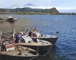 Higgins 78-foot torpedo boats of Motor Torpedo Boat Squadron 13 (MTBRon 13) moored in Attu, Alaska, Jul 943. Note PT-75 and PT-78 nested outboard of their squadron-mate and PBY Catalina patrol plane taking off.