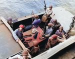 MGen George Patton and RAdm John Hall, US Navy (behind Patton – and, Yes, the Admiral has his helmet on backwards) prepare to go ashore at Fedhala, Morocco during the North African operation, 9 Nov 1942.