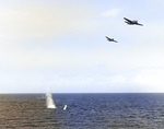 TBF-1 Avengers from the Carrier USS Essex dropping a practice torpedo from 150-200 feet, Gulf of Paria, Trinidad, 30 Mar 1943.  Note the porpoising early Mark XIII torpedo.