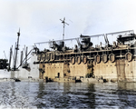 During rehearsals for the New Georgia operation, troops climb down nets hung over the side of attack transport USS McCawley to board LCVP landing craft at Nouméa, New Caledonia, 14 Jun 1943