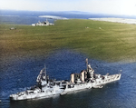 USS Tuscaloosa in Scapa Flow, Scotland, United Kingdom while she was operating with the British Home Fleet, April 1942. The British heavy cruiser HMS London is in the background.