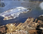 Aerial view of Ford Island in Pearl Harbor, Hawaii, 7 Jan 1941. Note the Pearl Harbor Naval Operating Base in the foreground and the carrier USS Lexington (Lexington-class) on the far side of Ford Island.