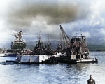 Seaplane derrick YSD-19 “Mary Ann” recovering the wreckage of Japanese Aichi D3A “Val” dive bomber that crashed in the water at Ford Island Berth F-2 during Pearl Harbor attack, Dec 1941.