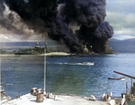 A view of Pearl Harbor’s Battleship Row from the Ten-Ten Dock at the Operating Base, 7 Dec 1941. Visible are battleships Maryland, the capsized Oklahoma, Tennessee, the sunken West Virginia, and Arizona’s masts.