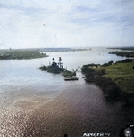 Battleship USS Nevada, surrounded by auxiliaries, grounded by the stern against the Waipi