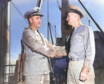 Captain Ralph Chrstie congratulating Lieutenant Commander John Moore of USS S-44 on the sinking of Kako, Brisbane, Australia, 23 Aug 1942