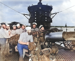 Chief Torpedoman Harold Stromsoe (far left) and others at the deck gun of USS S-44, Jan 1943