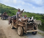 Early production Willys Jeep heavily field modified into a litter Jeep carrying wounded soldiers and medics on Saipan, Mariana Islands, Jun 1944.