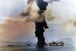 A column of smoke 500 feet wide rising from the capsized and burning fleet oiler USS Mississinewa after being struck by the first Japanese Kaiten deployed, Ulithi Atoll, 20 Nov 1944. Oiler USS Pamanset in the foreground.