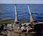 Sailors atop a 5-inch gun turret aboard USS New Jersey, Pacific Ocean, 21 Jul 1943