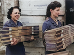 Members of the Auxiliary Territorial Service carrying recently arrived rifles made by the American firm Winchester, Britain, 1940s