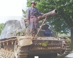 US 69th Infantry Division Captain Hans Trefousse posing with a SdKfz 165 self-propelled gun that he had captured by persuading the German crew to surrender on 25 Apr 1945, near Wurzen, Sachsen, Germany