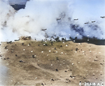 United States Army paratroopers dropped from C-47 Skytrains parachuting into Nazdab, New Guinea behind a smoke screen, 5 Sep 1943.