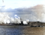 As seen from battleship USS Texas, Fletcher-class destroyer USS Twiggs engaging in a pre-invasion bombardment of Iwo Jima’s landing beach White 2 in support of underwater demolition team operations, 17 Feb 1945.