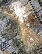 Aerial view of the Manzanar Airstrip, Inyo County, California, United States showing a portion of the Manzanar Relocation Center across the highway, 1 Oct 1944.