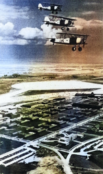 Three N3N aircraft in flight over Naval Air Station Glenview, Illinois, United States, early 1940s; seen in Mar 1980 issue of US Navy publication Naval Aviation News