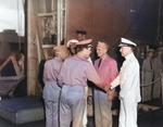 Flag officers aboard USS Enterprise being welcomed back to Pearl Harbor, Hawaii 5 Feb 1942 after the Marshalls-Gilberts Raids. VAdm William Halsey (center) with RAdm’s Aubrey Fitch and Raymond Spruance at each end.