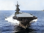 A bow-on view of USS Enterprise from an SBD Dauntless scout bomber that had just taken off, circa 1943. USS Lexington (Essex-class) is at right.