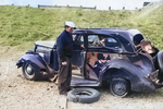 Sailor with bloody face standing next to the car the he was driving when they were both blown off the road by a massive munitions explosion at Port Chicago, California, United States, on 17 Jul 1944. 18 Jul 1944 photo.