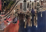 Straight down aerial view of the piers and drydocks at the Puget Sound Naval Shipyard, Bremerton, Washington, United States full of battleships and one carrier, USS Enterprise, 1940.