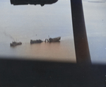 Destroyer USS Tucker after nearly being blown in two by a mine getting towed by the stern toward shallow water by YP-346, Espiritu Santo, New Hebrides, 4 Aug 1942.