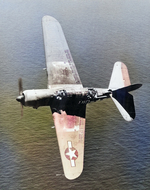 Interesting aerial view into the cockpit of an SB2C-4E or SBF-4E Helldiver with a Utility Squadron, probably in the western Pacific, 1945. Note the slotted wing flaps that served as dive-brakes.