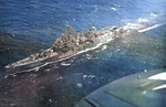 Aerial view of the cruiser USS Nashville underway, Pacific 1944