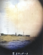 Photograph through the periscope of USS Skipjack of the torpedoed and sinking 7,000-ton freighter Shunko Maru 350 miles southwest of Truk, 14 Oct 1942.