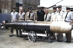 Seven United States Navy officers and one Chief Petty Officer pose with the station’s first Mark XIV torpedo at the Naval Torpedo Station at Keyport, Washington, United States, 1943.