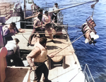 United States Navy sailors recovering a practice Mark 24 FIDO acoustic homing torpedo, 14 Jun 1950.