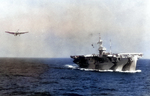 Escort carrier USS Bogue shortly after being repainted in Measure 32/Design 4A Dazzle paint scheme, 1944 in the Atlantic. Note the TBM Avenger in the landing pattern.