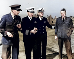 United States Navy Captain Miles Browning, Captain William Harrill, Captain F.B. McCrary, and Vice Admiral William Halsey at Naval Air Station Alameda, California, 6 Sep 1942. Note SNJ Texan aircraft.